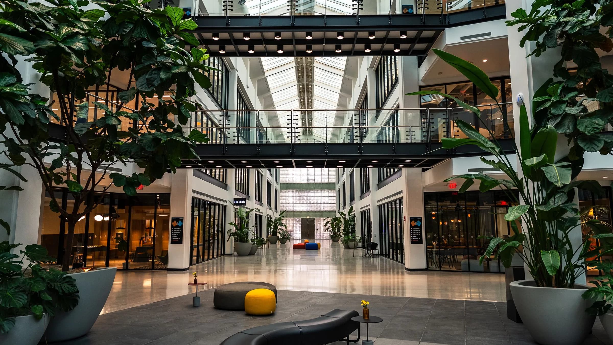 Office building atrium with plants and walkways